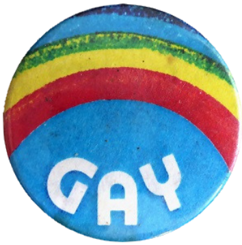 A blue pinback button with a rainbow reading: Gay