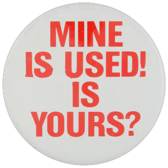 A white pinback button with red text reading: Mine is used! Is yours?